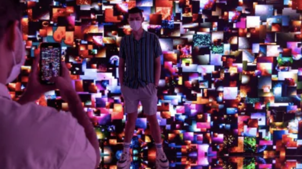 Man surrounded by digital screens